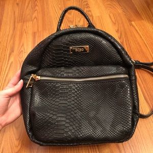Mini black snakeskin backpack